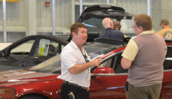 One of our Exhibitors, Explaining Tesla Model S, to in interested visitor.